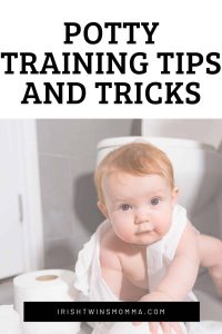 Potty Training with boy playing with toliet paper by the Irish Twins Momma